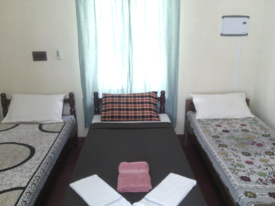 dormitory room with single beds in fort kochi